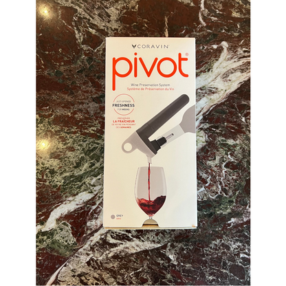 The Coravin Pivot in shade Grey, shown in its box on a marble table top